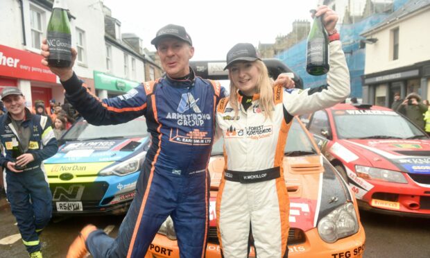 Snowman Rally winners Jock Armstrong and Hannah McKillop celebrate their win. Image: Sandy McCook/DC Thomson