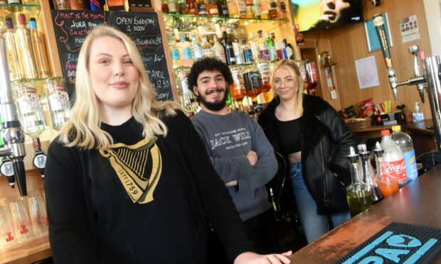 Jen Duffus (left) with bar staff Charlie Houe and Kiera Rennie. Image: Sandy McCook/DC Thomson