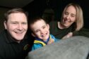 1st Elgin Beavers has been "life changing" for 7-year-old Louis Ross. He is 
 photographed with his parents Charlie and Margaret.
Image: Sandy McCook/DC Thomson