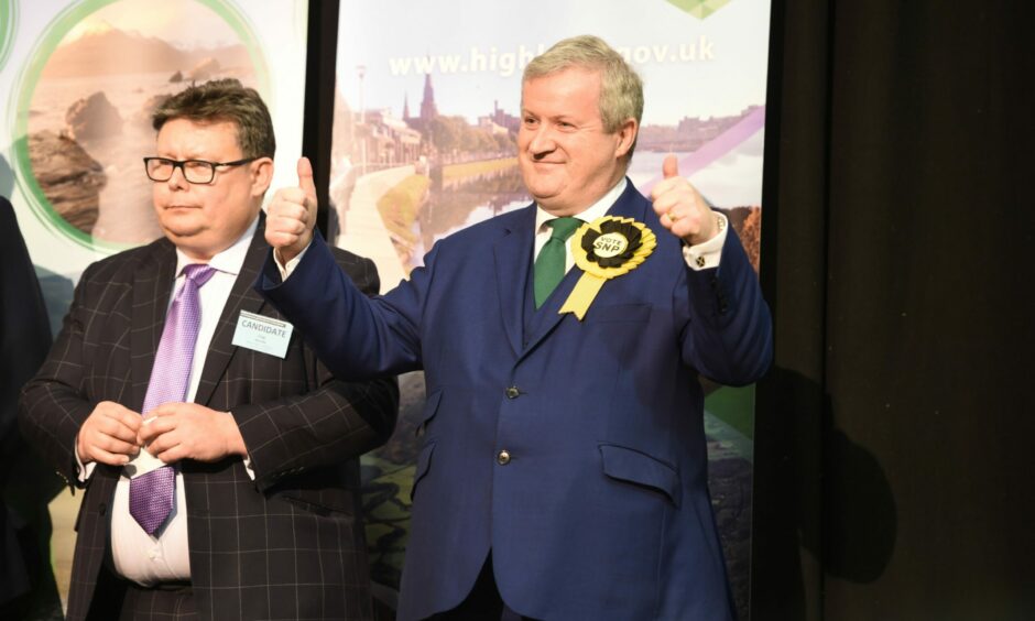 SNP's Ian Blackford celebrates being re-elected into the seat for Ross, Skye and Lochaber at Inverness Sports Centre. 