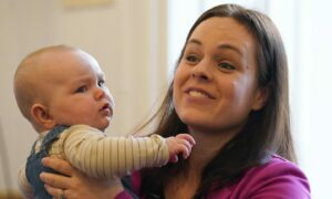 Kate Forbes, pictured with daughter Naomi, during a campaign stop on Thursday. Image: Andrew Milligan/PA.