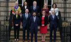 Newly elected First Minister of Scotland Humza Yousaf on the steps of Bute House, Edinburgh, with his cabinet after their first meeting. Picture date: Wednesday March 29, 2023. PA Photo. See PA story POLITICS FM. Photo credit should read: Andrew Milligan/PA Wire