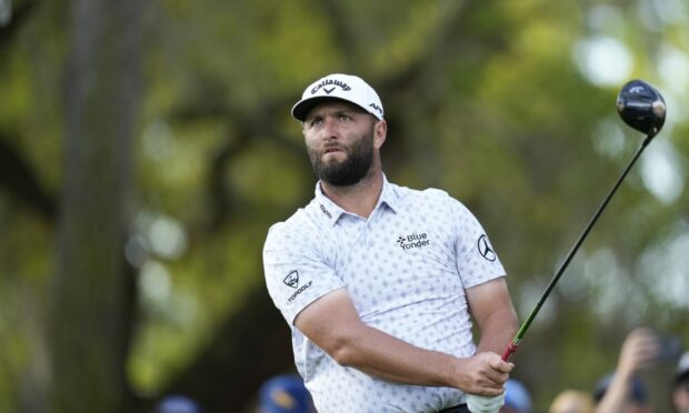 Jon Rahm watches his tee shot from the 12th tee during the first round of the Players Championship. Image: AP.