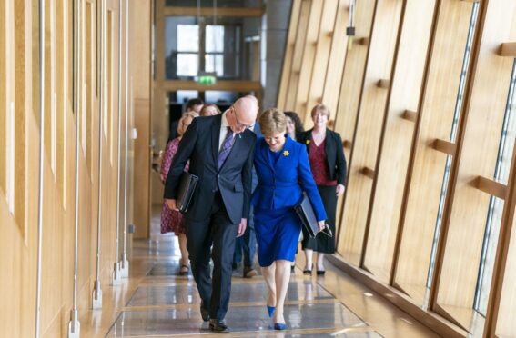 John Swinney and Nicola Sturgeon at the Scottish Parliament. Image: PA