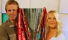 Former Soccer AM presenters Tim Lovejoy and Helen Chamberlain with the Johnstone's Paint Trophy. Image: PA.