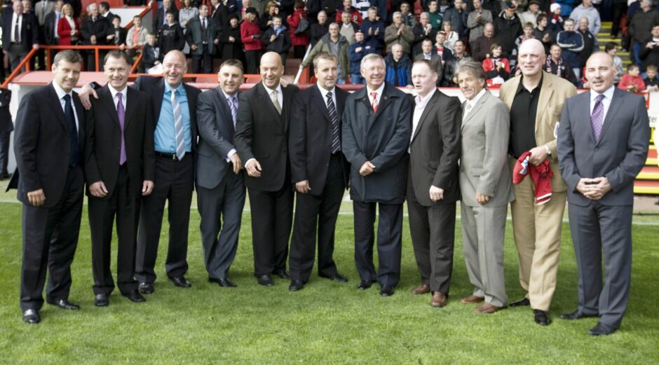 The 1983 Aberdeen European Cup Winners' Cup squad at Pittodrie in 2008. From left: Eric Black, Ian Angus, Neil Simpson, John Hewitt, Neale Cooper, Peter Weir, Sir Alex Ferguson, John McMaster, Stuart Kennedy, Bryan Gunn and Willie Miller.