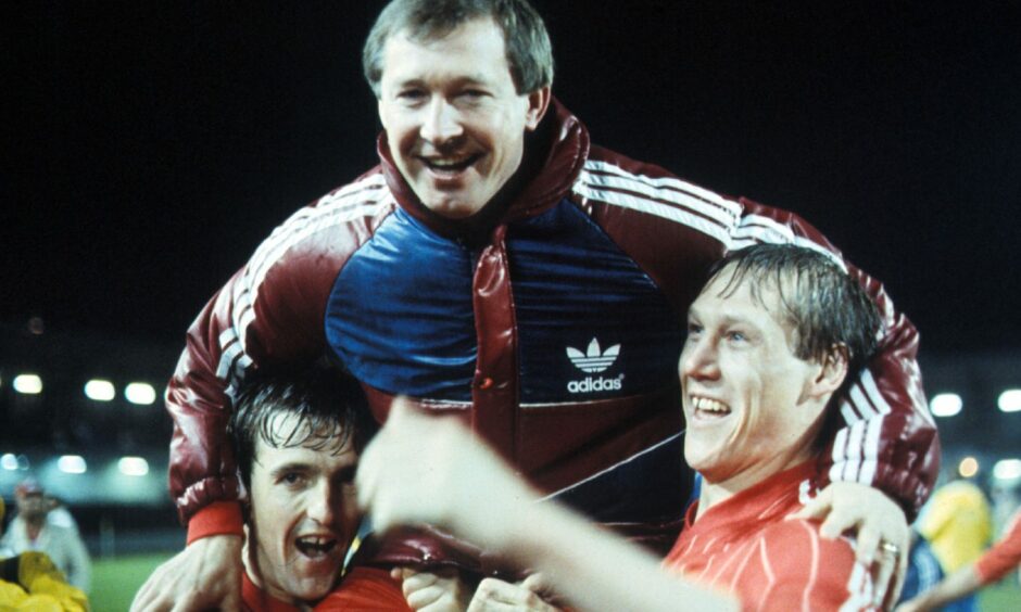 Aberdeen boss Alex Ferguson is held high by his players after winning the European Cup Winners' Cup in Gothenburg. Image: SNS
