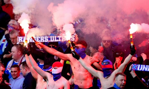 Rangers fans set off pyrotechnics during the League Cup final at Hampden. Image: PA