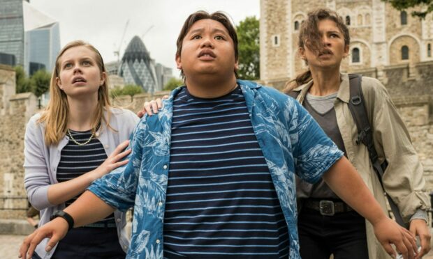 Betty Brant (Angourie Rice), Ned Leeds (Jacob Batalon) and MJ (Zendaya) look up at Mysterio's menacing drones above London in Spider Man: Far from Home. Image: Sony Pictures