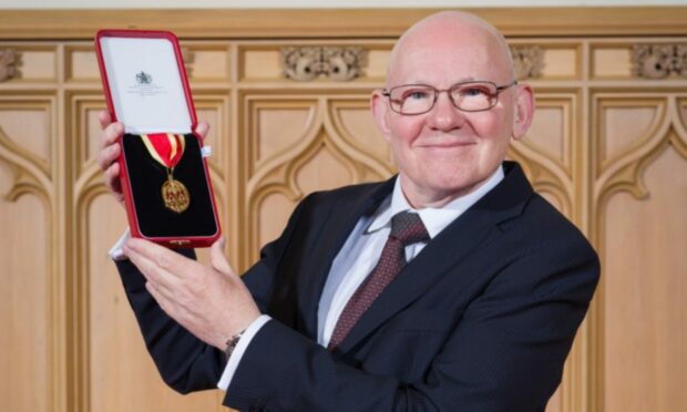 Sir Peter Bruce with his knighthood