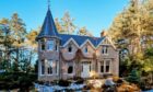 This beautiful granite home has a fairytale style tower. Images: Laurie & Co