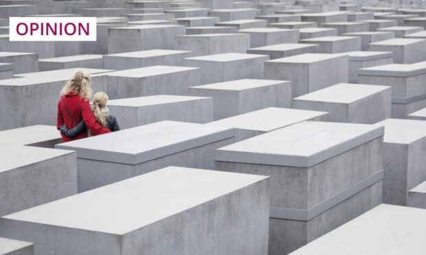 A family visit Berlin's Holocaust memorial (Image: Anton Havelaar/Shutterstock)
