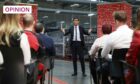 Prime Minister Rishi Sunak holds a Q&A session with local business leaders during a visit to Coca-Cola HBC in Lisburn, Northern Ireland (Image: Liam McBurney/AP/Shutterstock)