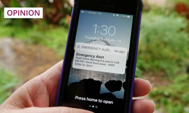 The UK will soon test its own country-wide emergency text message system, like the USA version pictured here (Image: Simone Hogan/Shutterstock)