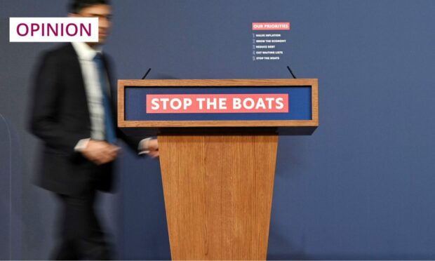The Conservative Party's 'Stop the boats' signage has proved controversial to some (Image: Leon Neal/AP/Shutterstock)