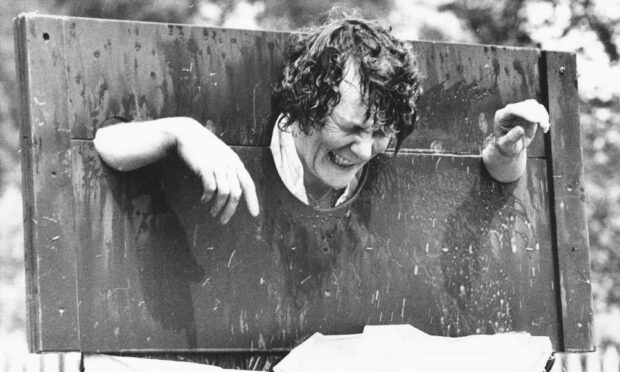 1990 - Tillydrone Community Council secretary Aileen Goymer takes a pelting with wet sponges as part of gala day events.