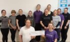 Deeside fitness group presented the money to Banchory Area First Responders. Image: Deeside Fitness.