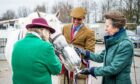Robert Auchnie from Aberchirder pictured with Princess Anne and the overall horse winner from Mrs Alex Middler. Image: Wullie Marr/DC Thomson