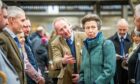John Gordon, from Huntly, introduces Princess Anne to the Royal Northern Agricultural Society board of directors at the Spring Show. Pictures by Wullie Marr.