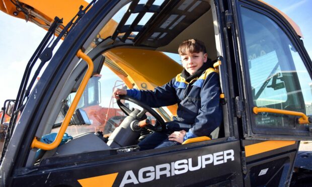 Jake Campbell in one of the heavy machinery vehicles. Image: Colaren Homes and Colaren Farms.