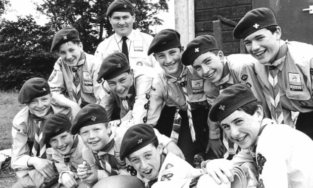 Arthur Pearson outside the old Scout Hall in Stonehaven, July 1990, with a group of Air Scouts ahead of a summer camp in Campbeltown - the town where Arthur once lived.