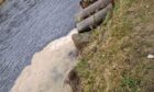 Incidents of brown muck pouring out of this pipe and polluting the River Dee have been reported to Sepa at least 14 times now. Kirkwood Homes says it is taking preventative measures. Image: Ken Reid.