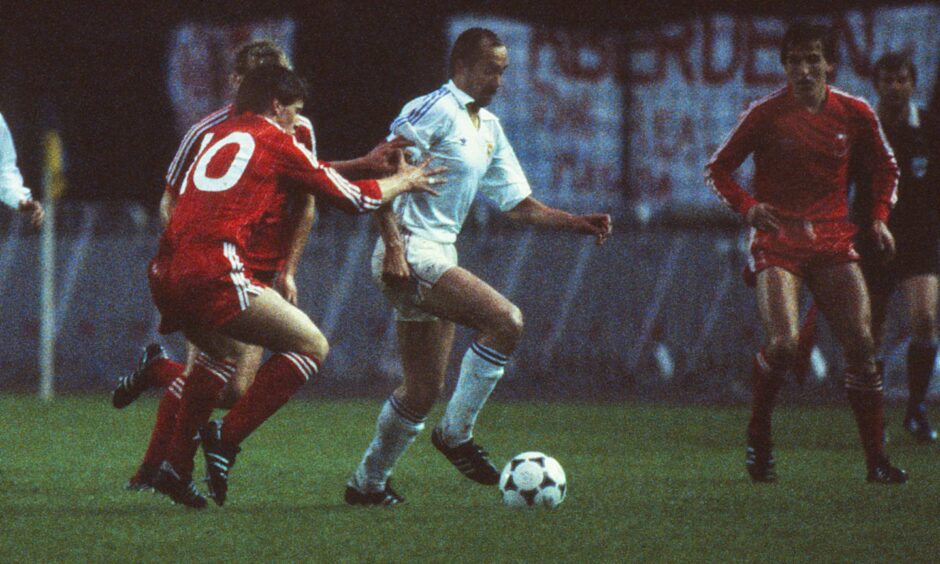Real Madrid's Ulrich 'Uli' Stielike on the ball with Aberdeen's Eric Black. Image: Shutterstock