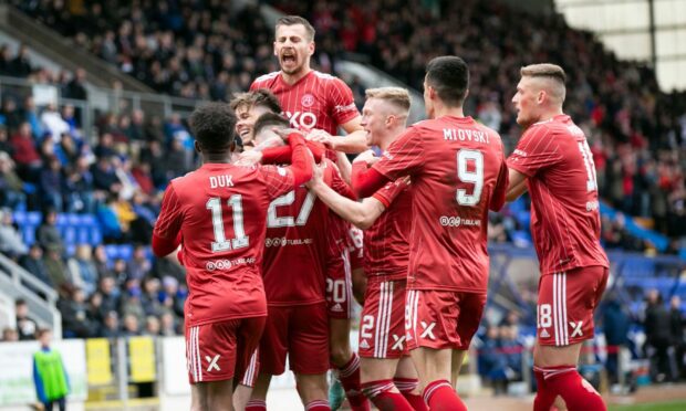 Aberdeen defender Angus MacDonald celebrates after his volley is fumbled into the net by St Johnstone keeper Remi Matthews last Saturday. Image: Shutterstock