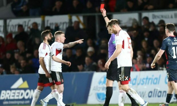 Aberdeen skipper Graeme Shinnie is sent off against Ross County by referee Euan Anderson. Image: Shutterstock