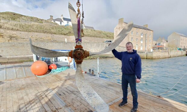 Fisherman Ray Macphee was not expecting to find the huge propeller in his fishing net. Image: David Mackay/DC Thomson