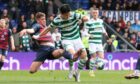 Ross County;'s Dylan Smith slides in to halt Celtic's Oh Hyeon-gyu. Image: Craig Williamson/SNS Group
