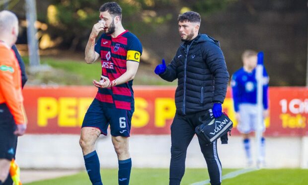 Alex Iacovitti receives treatment during Ross County's win over St Johnstone. Image: SNS
