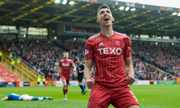 Aberdeen's Bojan Miovski celebrates Luis Lopes' (not in frame) second goal during a cinch Premiership match between Aberdeen and Kilmarnock at Pittodrie, on April 08, 2023, in Aberdeen, Scotland.