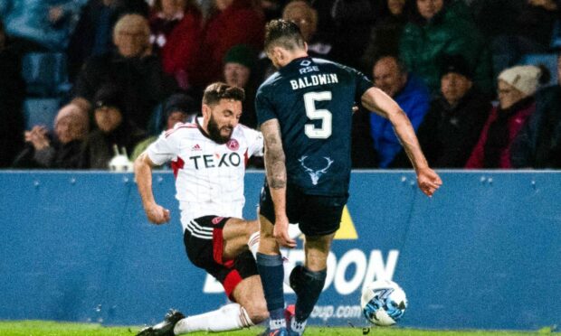 Graeme Shinnie's challenge on Jack Baldwin which resulted in a red card. Image: SNS