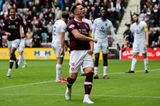 Hearts' Lawrence Shankland (C) celebrates scoring to make it 3-0 against Ross County. Image: SNS