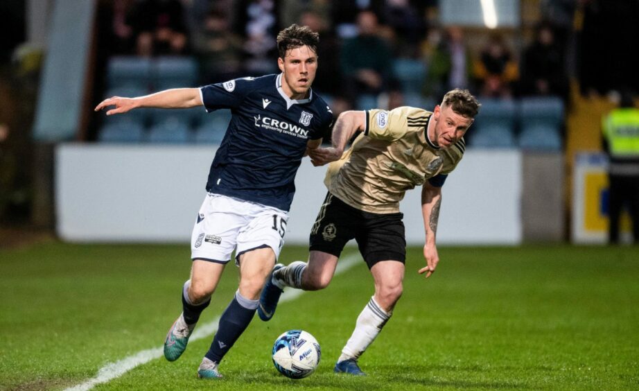 Cove Rangers' Mitch Megginson and Dundee's Josh Mulligan in action at Dens Park.