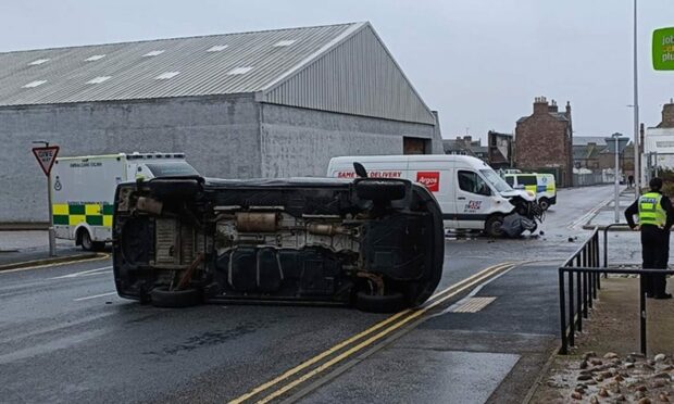 The car involved landed on its side on St Peter Street, Peterhead. Image: Peterhead Live/Facebook.