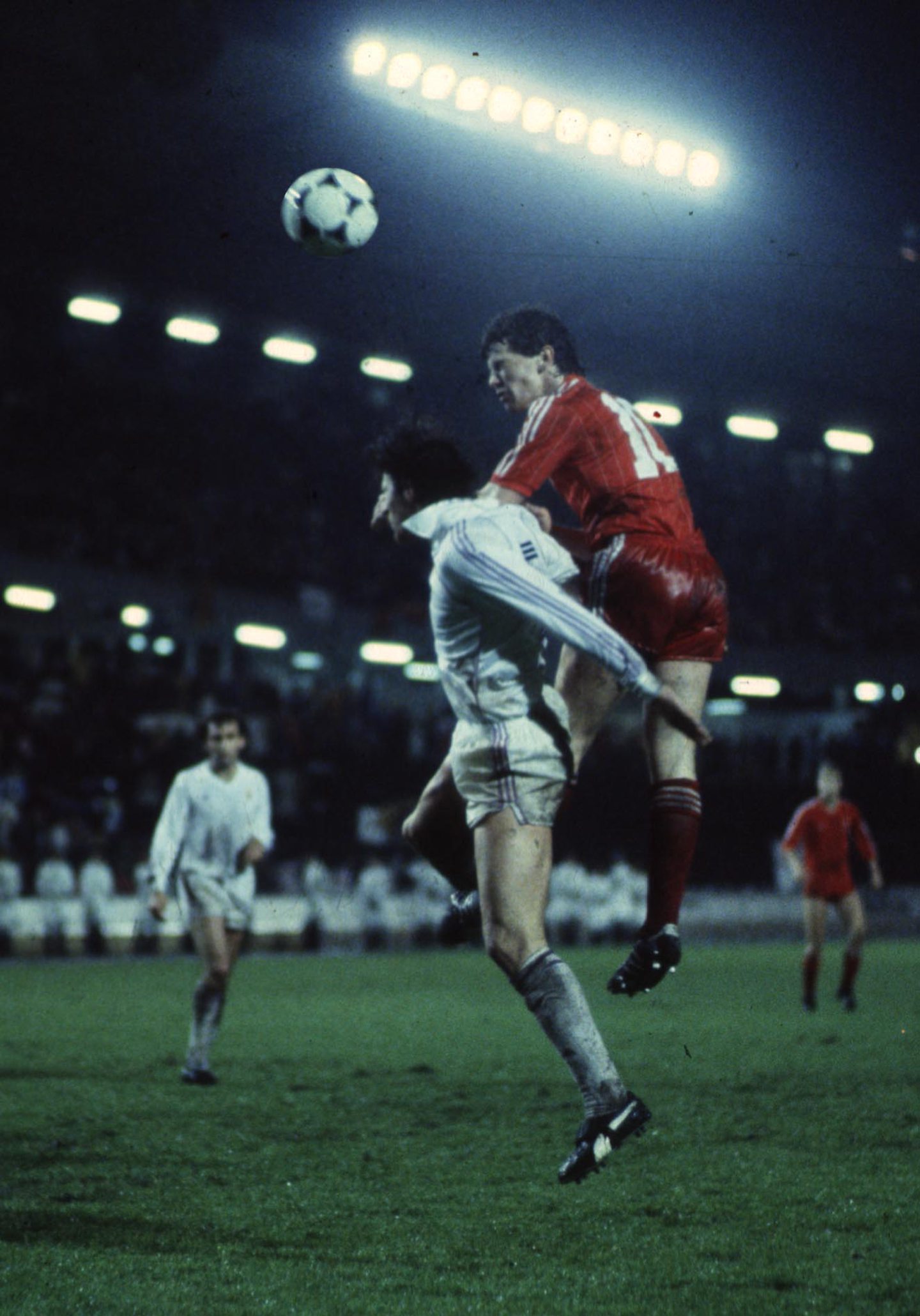 Aberdeen's Eric Black (right) jumps above Paco Bonet of Real Madrid. Image: Shutterstock.