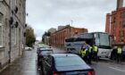 A coach containing Rangers supporters was targeted during disturbances on Hutcheon Street. Image: DC Thomson