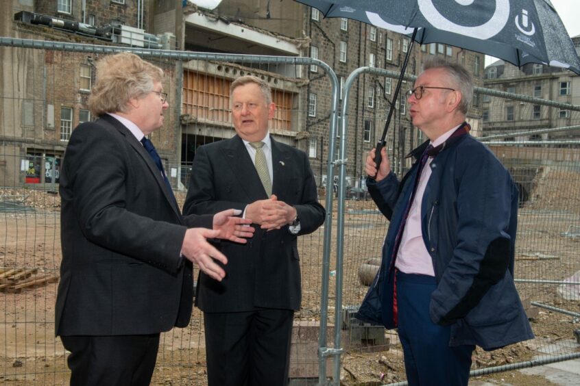 Lib Dem council co-leader Ian Yuill, SNP co-leader Alex Nicoll and Levelling Up Secretary Michael Gove at the Aberdeen market site in May. Image: Norman Adams/Aberdeen City Council.