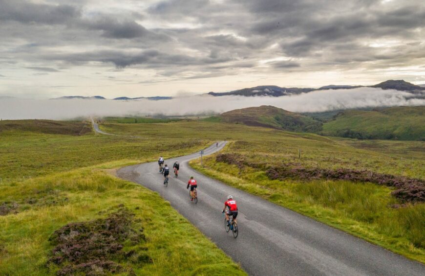 Five cyclists on the scenic Etape Loch Ness route.