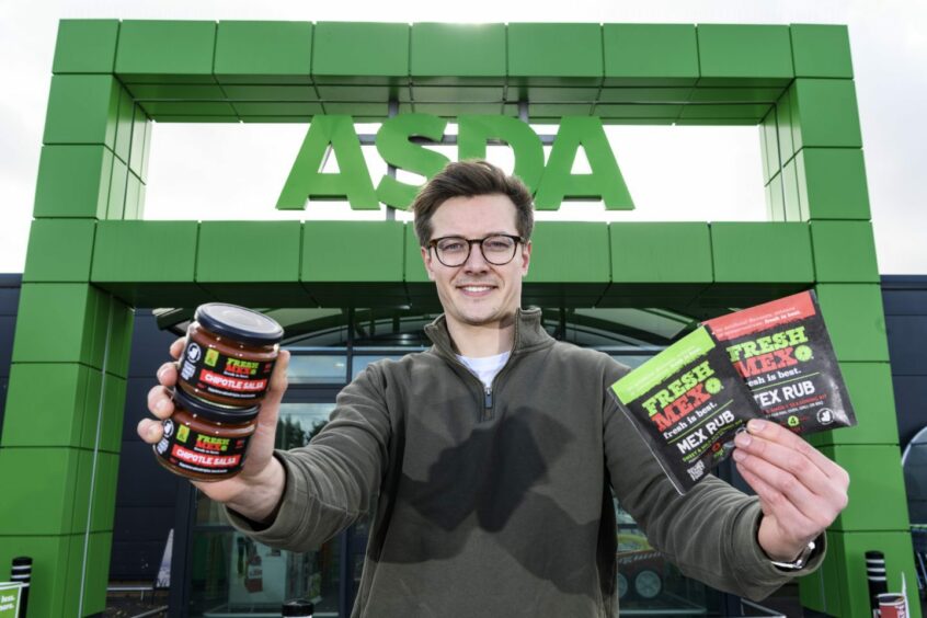 FreshMex founder Robbie Moult in front of Asda storefront. 