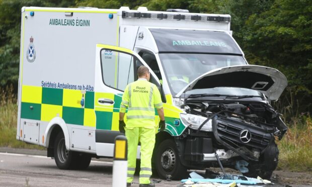 An ambulance was seriously damaged during the three-vehicle collision. Image: Chris  Sumner.