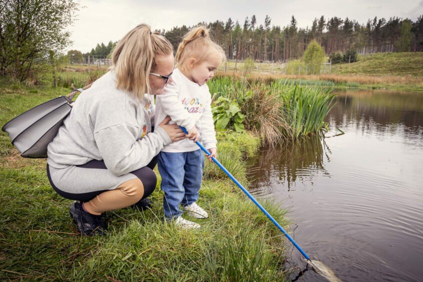 mother and child explore local pond during Cairngorms Nature Festival