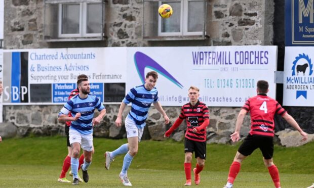 Jevan Anderson, centre, in action for Banks o' Dee in the Highland League Cup final.