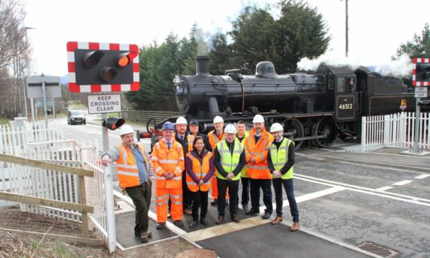 A group of officials open the new and safer Dalfaber level crossing in Aviemore. Image: Frances Porter Photography