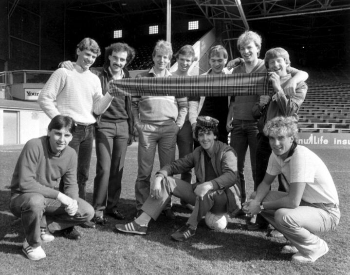 A delighted Peter Weir is congratulated by other members of the Dons team included in Scotland's full and under-21 squads for their games against Switzerland in 1983. The others are, from left - John Hewitt, Eric Black, Willie Miller, Neil Simpson, Alex McLeish, Jim Leighton, Bryan Gunn, Gordon Strachan and Neale Cooper in 1983.