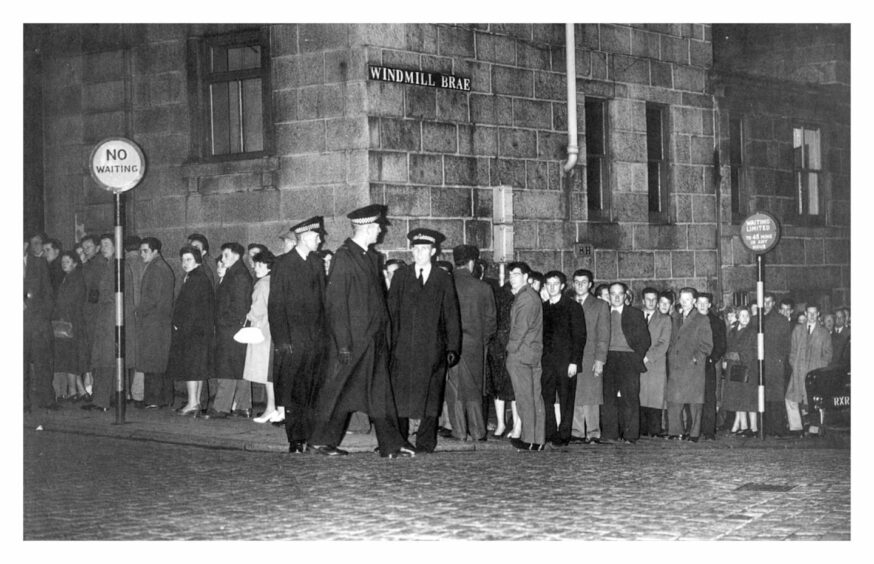 Queues snaked all the way from the Gaumont Cinema - soon to be flats - onto Crown Street and all the way down Windmill Brae for the opening of Hitchcock's Psycho in October 1960. Image: DC Thomson. 