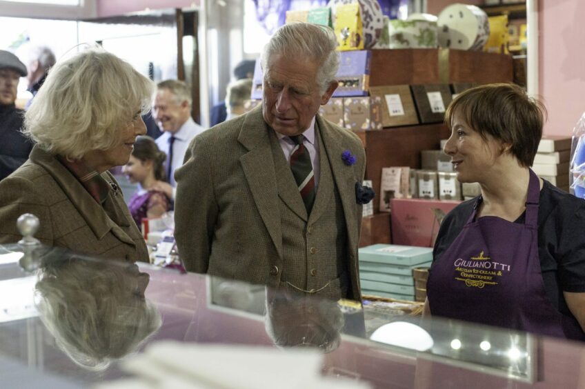 Camilla and Charles hear the history of the 120-year-old E Giulianotti sweet shop.
