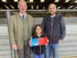 Tom Stewart of sponsors Galbraith, with Steven and Lily Smith, who stood champion and reserve.